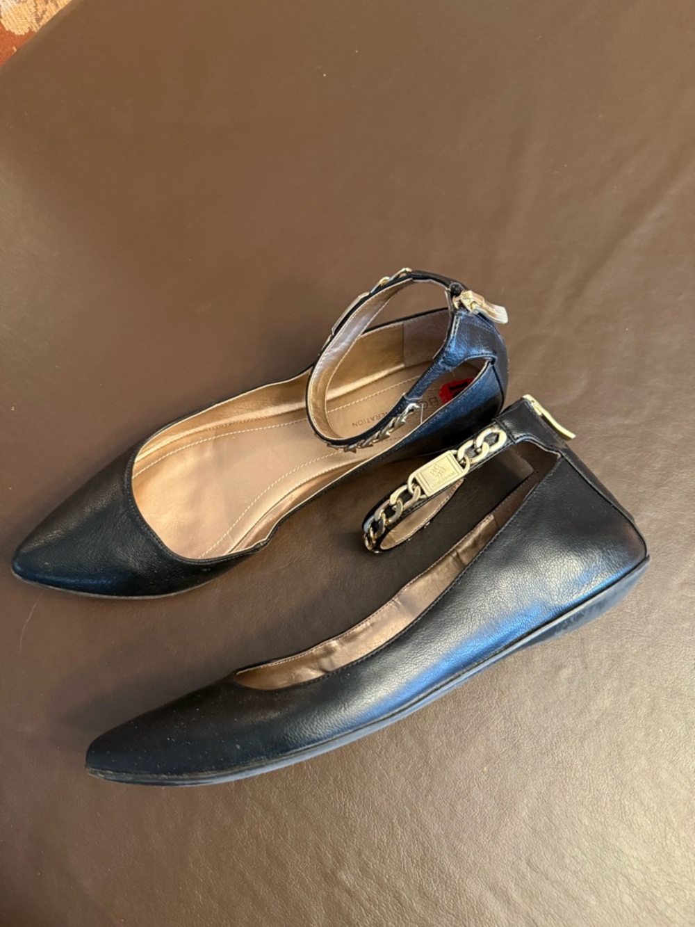 BCBGeneration Black Leather Pointed-Toe Ankle-Strap Flats with Gold Chain